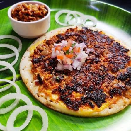 South Indian curry dosa with spiced filling, served with chutney and sambar.
