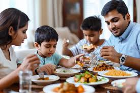 Family dining together at an Indian restaurant, enjoying traditional dishes and quality time