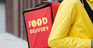 Indian restaurant takeaway meals in disposable containers for delivery or pickup.