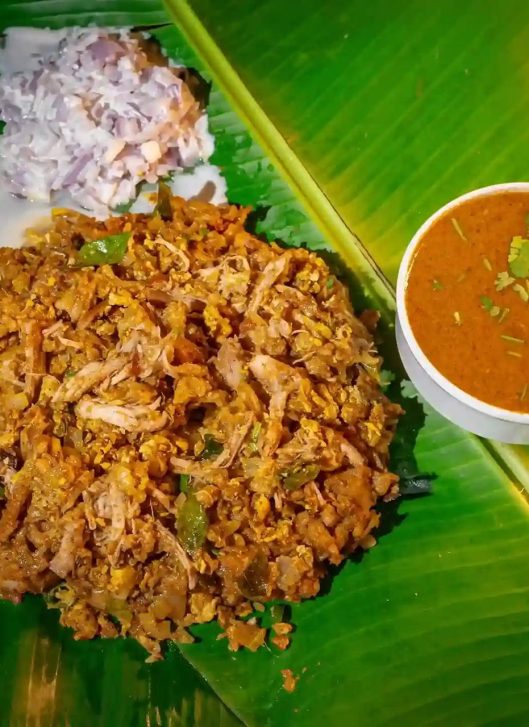 Authentic South Indian kothu parotta with chopped parotta, egg, and flavorful spices.